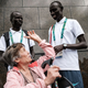 Yiech Pur Biel (left), based in Kenya, and South Sudan’s James Nyang Chiengjiek (right), for the Refugee Olympic Team talk with a tourist at the statue of Christ the Redeemer July 30, 2016, ahead of the 2016 Rio Olympics in Rio de Janeiro.
YASUYOSHI CHIBA/AFP/Getty Images